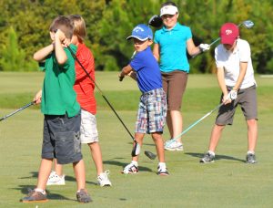 children playing golf